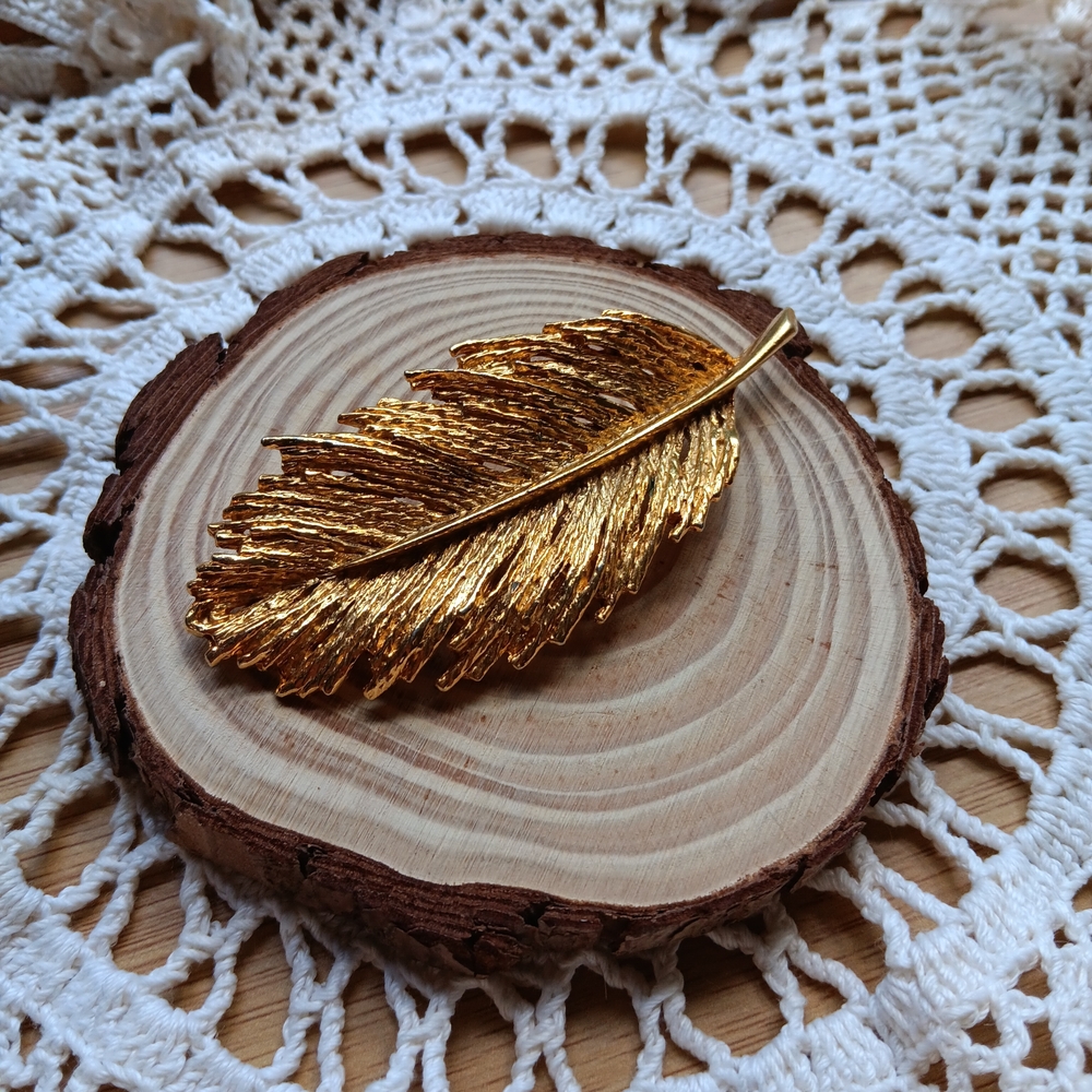 Radiant Gold Tone Feather Brooch